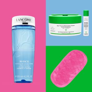 Blue eye makeup remover stands on pink, cleansing balm with exfoliant sits on blue, pink makeup remover cloth lies on green.