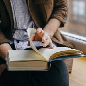 close up of man reading a book