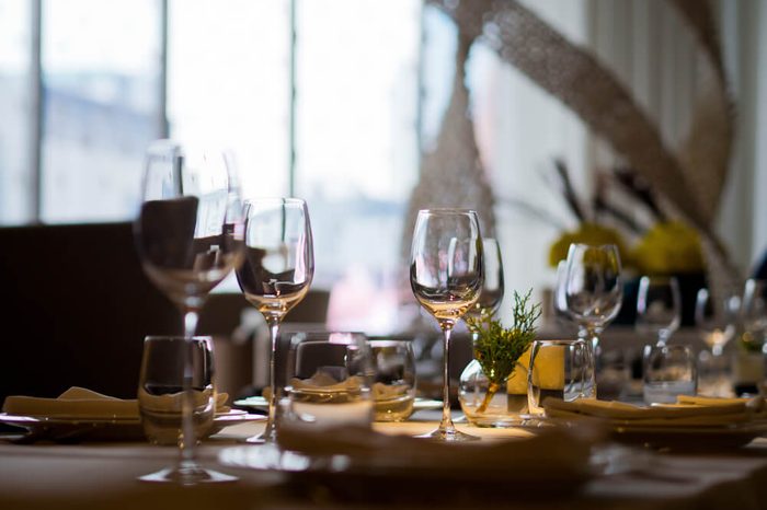 dish spoon fork on table at restaurant. wine glass