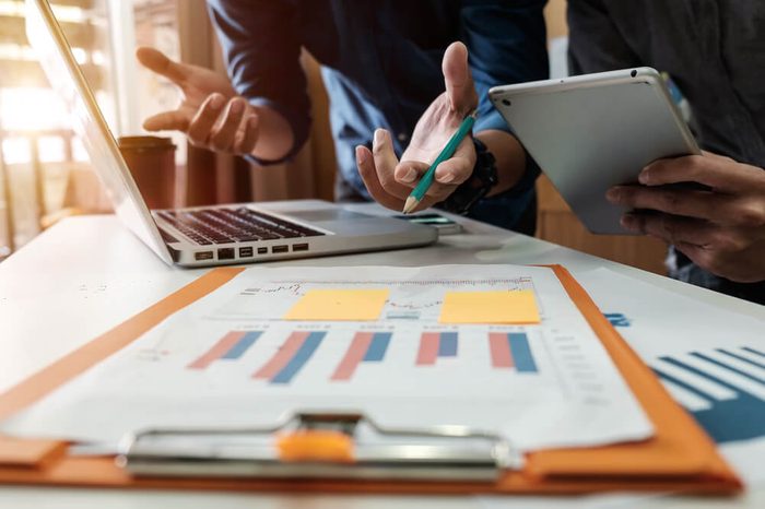 Business team meeting present.professional investor working with new startup project. Finance managers task.Digital tablet laptop computer design smart phone in morning light