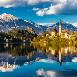 Amazing View On Bled Lake, Island,Church And Castle With Mountain Range (Stol, Vrtaca, Begunjscica) In The Background-Bled,Slovenia,Europe