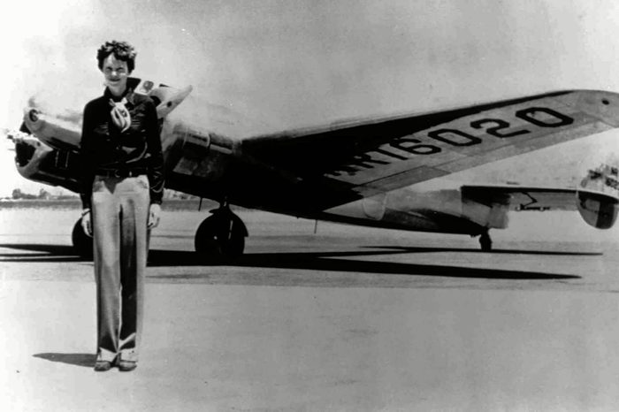 EARHART Amelia Earhart, 40, stands next to a Lockheed Electra 10E, before her last flight in 1937 from Oakland, Calif., bound for Honolulu on the first leg of her record-setting attempt to circumnavigate the world westward along the Equator