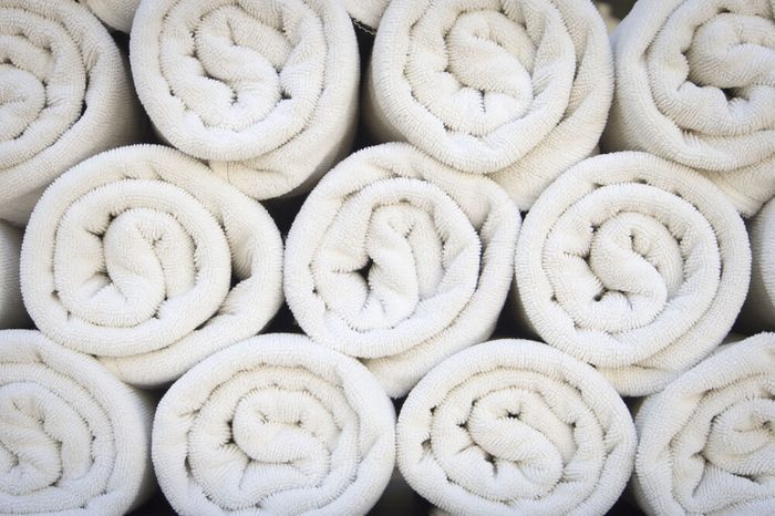 Rolled up white spa towels
