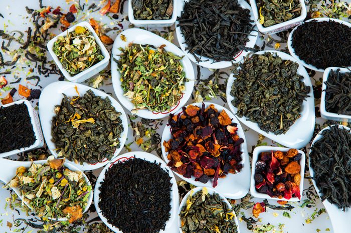 Assortment of dry tea. Various kinds of tea isolated on white.Different kinds of tea leaves. Tea composition with different kind of tea. Tea concept. Tea leaves