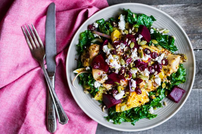 Healthy salad with grilled chicken,kale.beets and goat cheese