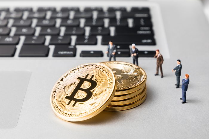 Group of people watching bitcoins. Virtual currency concept.