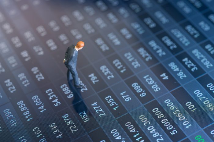 Concept of financial stock market. Businessman thinking with stock market number.