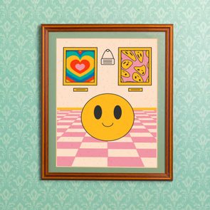 Yellow smiley face sits on checkered floor, flanked by heart and cheese paintings, framed on a patterned teal wallpaper.