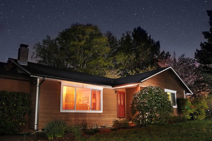 Family home at night underneath the stars