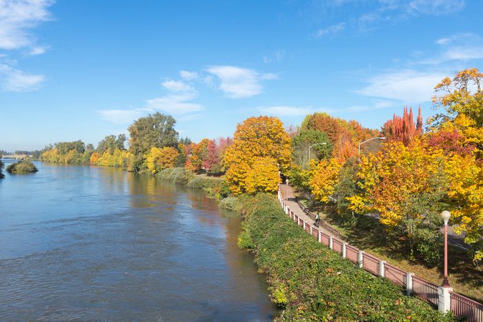 The Willamette River flows beside a bike path in Eugene, Oregon.