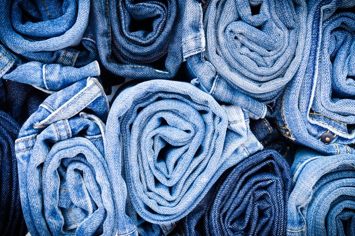 Blue jean background .Blue denim jeans texture. Jeans background. Blue torn denim jeans texture.classic nature tone jean.denim jeans texture background with frayed hole, black fabric grunge background