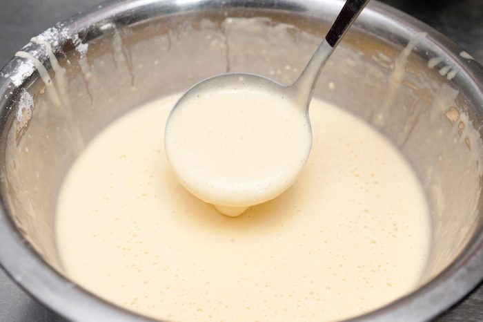 Mixing dough for pancake.