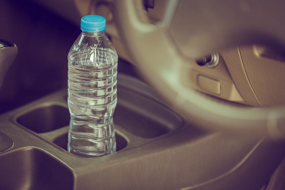 image concept Bottled water was left in the car for a long time. To drink it?