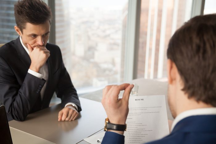 Worried unhired job applicant feeling nervous while employer or recruiter reviewing bad resume, unprepared vacancy candidate waiting for result, afraid to fail employment interview and be rejected