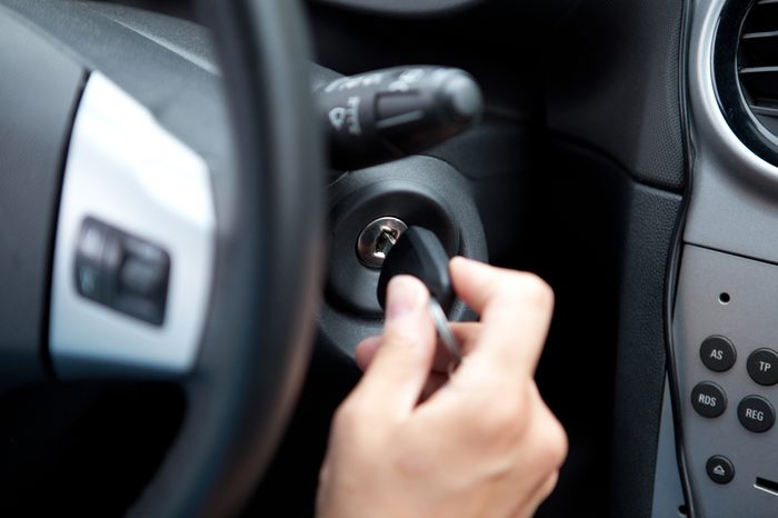 Woamn's Hand on the Car Ignition Key