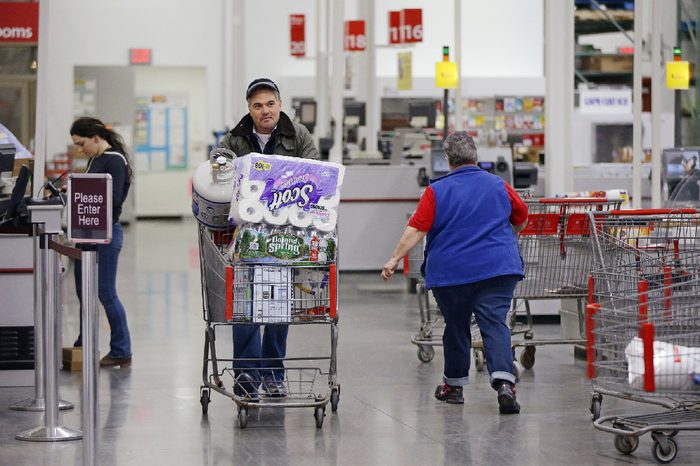 Tony D'Angelo walks away from the scan check out lane after completing his purchase using the BJ's Express Scan app on his cell phone while shopping at the BJ's Wholesale Club in Northborough, Mass. Like other automation technologies, scan-and-go shifts more of the work to shoppers while freeing up employees for higher-value tasks. That's especially critical as stores look for ways to make their workers more efficient as they wrestle with rising wages