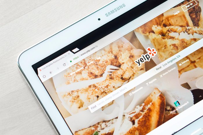 JYVASKYLA, FINLAND - JULY 1, 2017: Yelp home page on tablet screen. Yelp is a website that publish crowd-sourced customer reviews and ratings for local businesses. Editorial.
