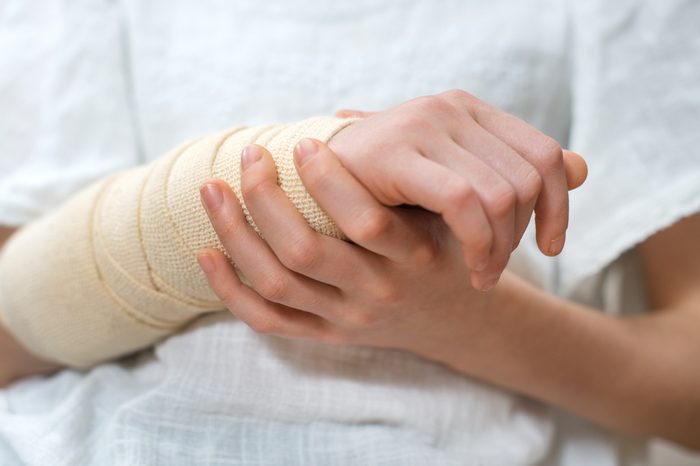 Child arm with elastic bandage on it.