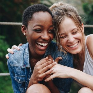 Happy friends holding each other