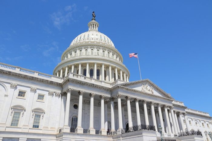 Washington DC, United States landmark. National Capitol building with US flag.