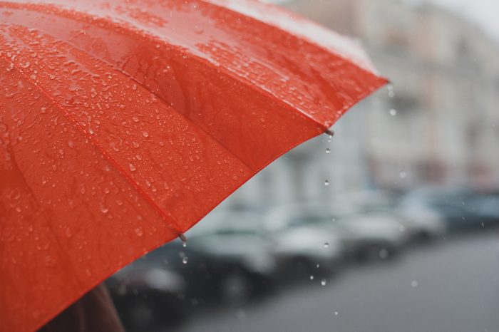 rain drops falling from a orange umbrella