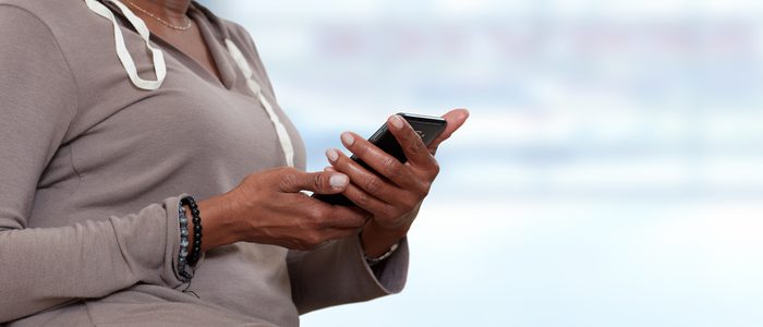 Hands with smartphone.