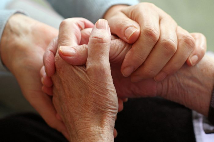 two pairs of hand touch each other, together, helping hands