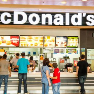 BUCHAREST, ROMANIA - SEPTEMBER 14: People buying fast-food from McDonald's Restaurant on September 14, 2012 in Bucharest, Romania. McDonald's is the main fast-food restaurant chain in Romania.