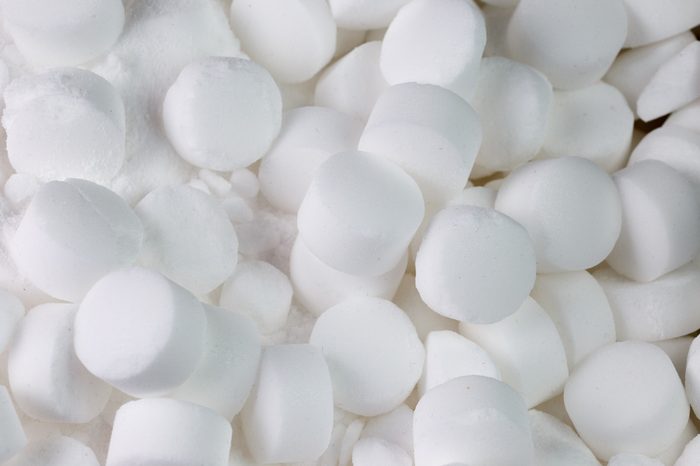Salt pellets for environment friendly cleaning dishes. Used in dishwasher and water softener.