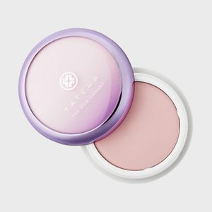 Compact case opened displaying pink cream, lid labeled 