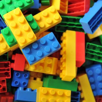Plastic toy blocks on white background