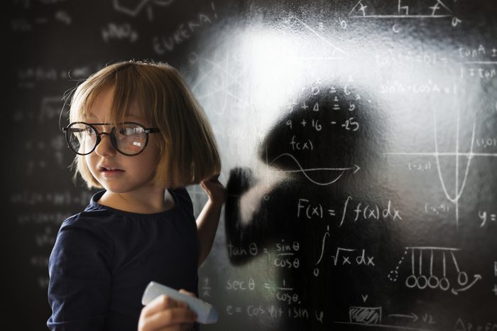Little genius drawing up some science
