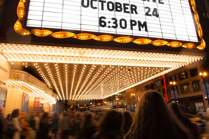 People going to cinema theater at the evening time