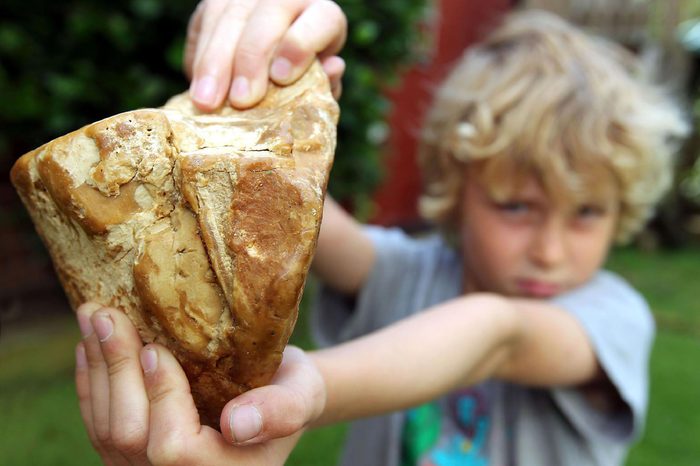 8-year-old Charlie Naysmith with the piece of ambergris