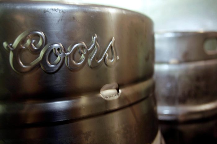 Barrels of Coors beer stand at Coors Field in Denver. Miller Coors' sustainability report, shows the brewer has cut down its water use to 3.48 barrels of water per barrel of beer a 9.2 percent drop from 2012. That's roughly 1 billion barrels of water