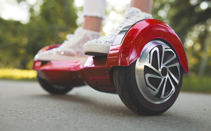 Girl feet on the hover board.