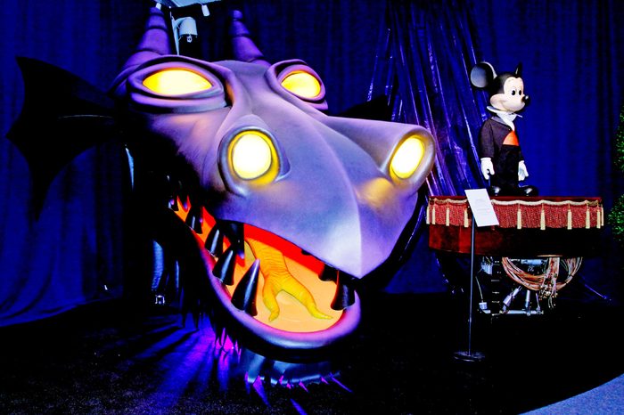 The dragon head "Maleficent" from the "Fantasmic!" show on Tom Sawyer's Island at Disneyland Park from 1992 is displayed next to an audio-animatronic figure of Mickey Mouse from Fantasyland in 1971 during a preview of "D23 Presents Treasures Of The Walt Disney Archives," at the Ronald Reagan Presidential Library & Museum in Simi Valley, Calif., . D23, the official Walt Disney fan club, refers to 1923, the year Disney founded his world-famous company. The exhibit features more than 500 historic artifacts, including models, props, artwork and set pieces, many never before seen by the public, from nearly nine decades of Disney history. The exhibit opens to the public on July 6