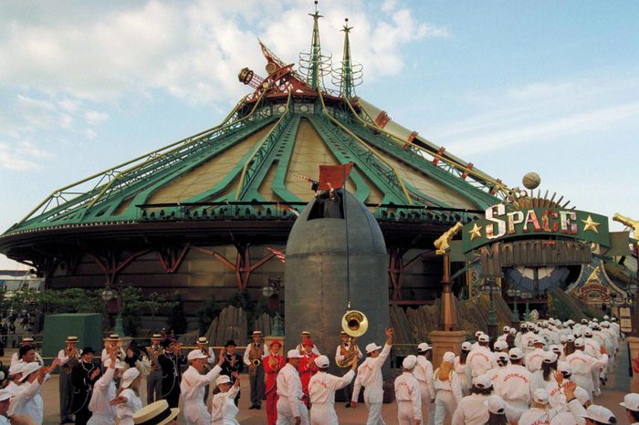 Winners of a Europe-wide contest to be the first to ride in Space Mountain wave to the crowd before they enter the Space Mountain building at Disneyland Paris in Marne-la-Vallee, east of Paris on . Space Mountain, which simulates a ride to the moon, was inaugurated on Wednesday night and will be open to the public on Thursday. It is inspired by the Jules Verne novel "From the Earth to the Moon