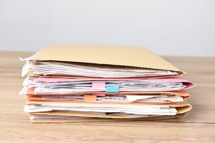 File Stack top view, file folder pace on wood desk background
