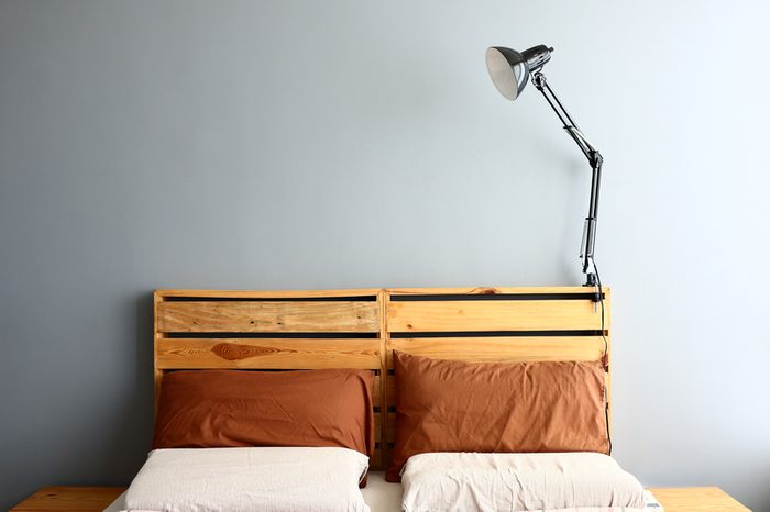 Loft bedroom with lamp turned off.