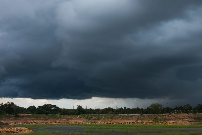 nimbostratus clouds /it was beginning to rain above the pool/ countryside of Thailand