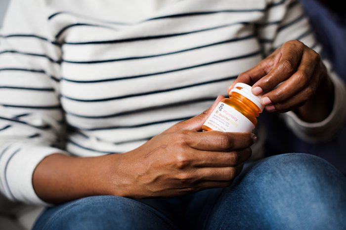 Woman taking pills for her health