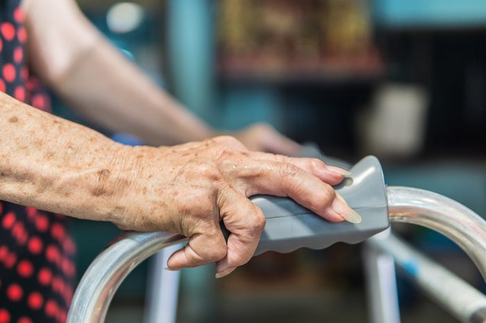 Elderly female patient hand and walker, Medical and healthcare concept.