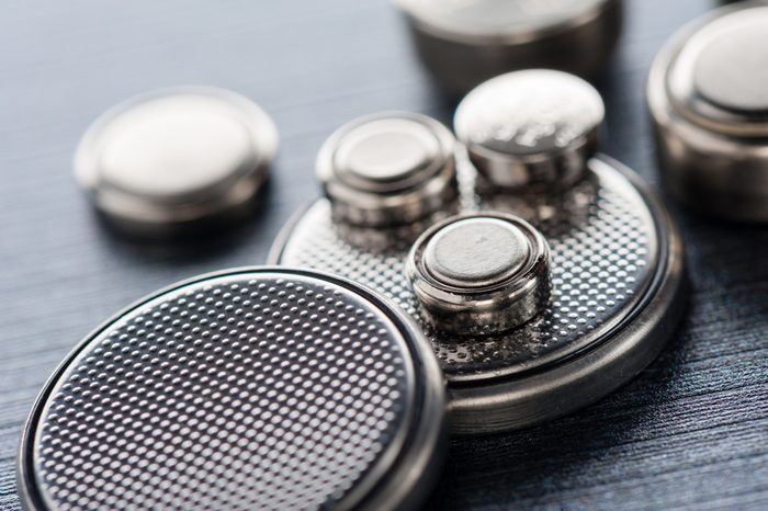 closeup button cell battery or watch battery or coin cell, used to power small electronics devices such as wrist watches or computer motherboard.