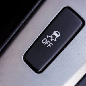 Button showing a skidding car symbol and 