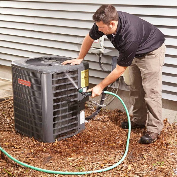 Man cleaning an air filter