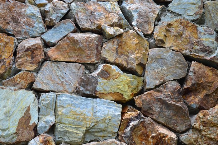 Grunge granite stone wall texture and background