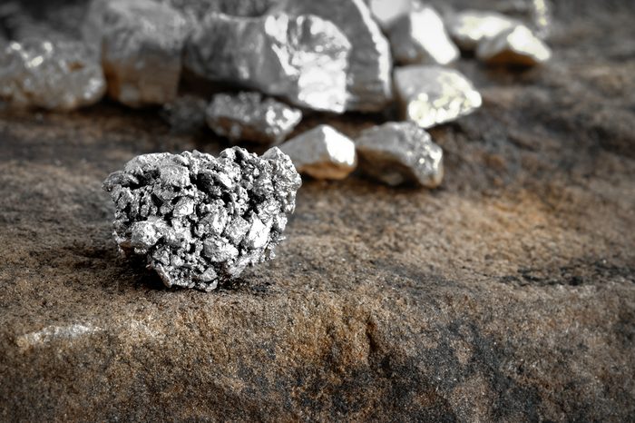 lump of silver or platinum on a stone floor