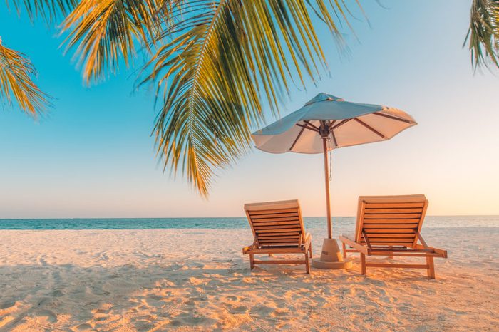 Tranquil beach scene. Exotic tropical beach landscape for background or wallpaper. Design of summer vacation holiday concept.