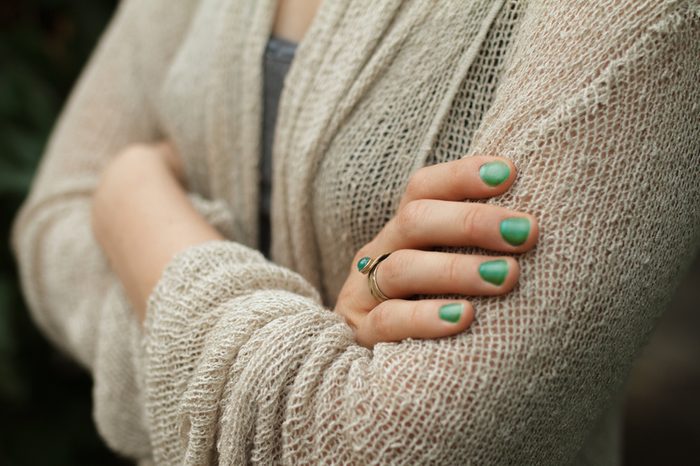 Fold One's Arms. Woman cross arms in wool jacket.